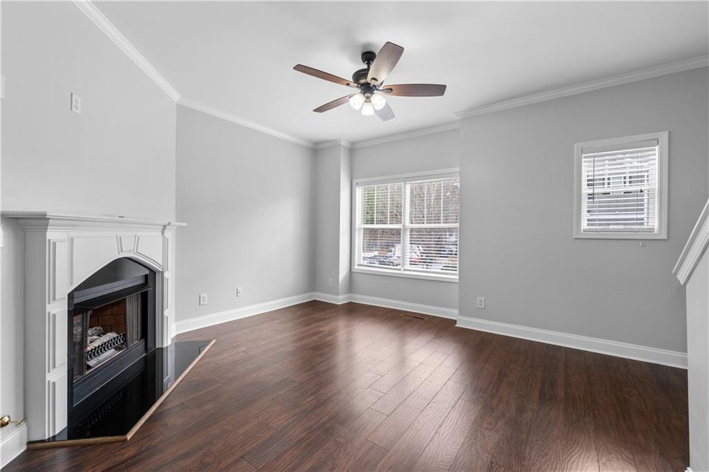 3072 Lauren Parc Road Decatur, GA 30032 - Photo 23 of 36 a view of an empty room with wooden floor and a window