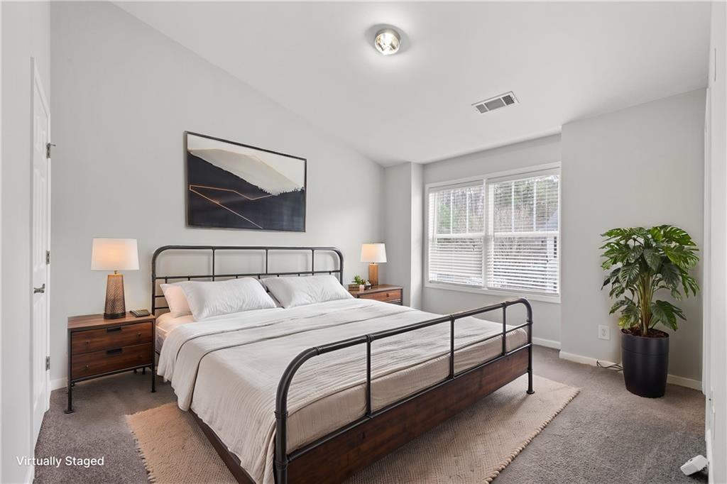 3072 Lauren Parc Road Decatur, GA 30032 - Photo 26 of 36 a bedroom with a bed and a potted plant