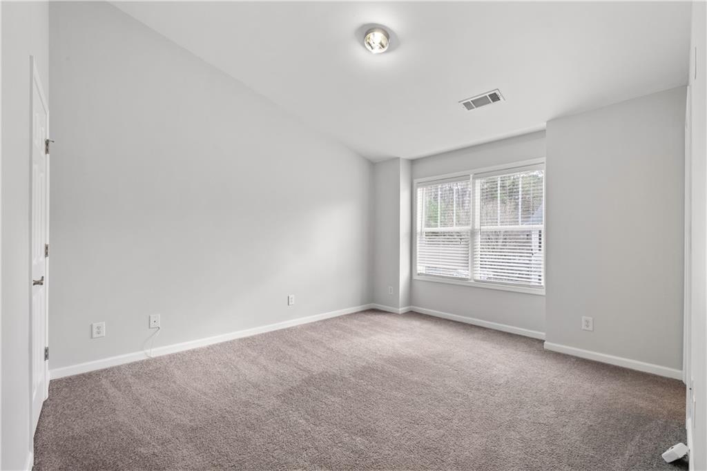 3072 Lauren Parc Road Decatur, GA 30032 - Photo 27 of 36 an empty room with a window