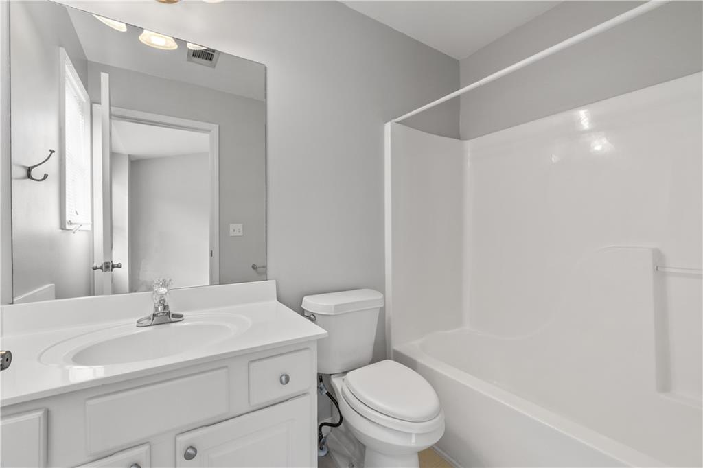 3072 Lauren Parc Road Decatur, GA 30032 - Photo 29 of 36 a bathroom with a sink toilet vanity and tub