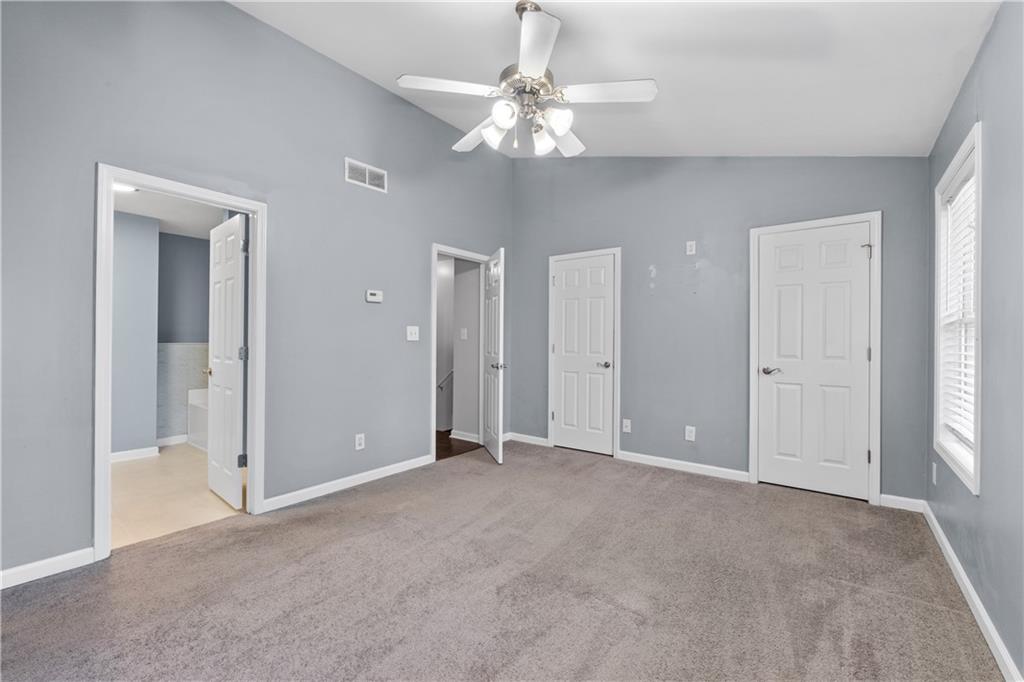3072 Lauren Parc Road Decatur, GA 30032 - Photo 32 of 36 a view of an empty room with a chandelier fan