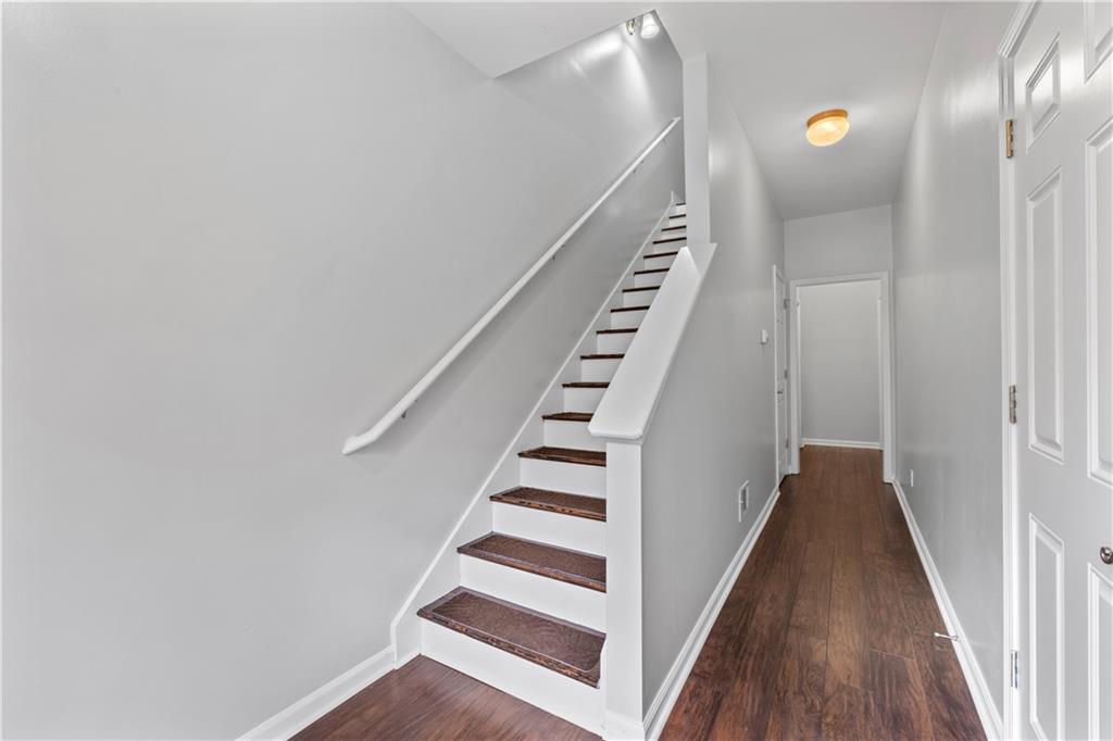 3072 Lauren Parc Road Decatur, GA 30032 - Photo 6 of 36 a view of a hallway with stairs and wooden floor