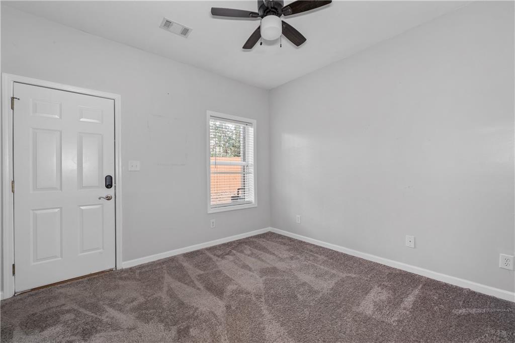 3072 Lauren Parc Road Decatur, GA 30032 - Photo 8 of 36 a view of an empty room with a window