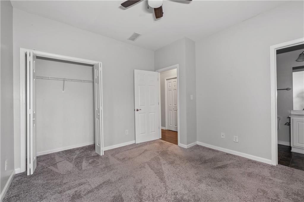 3072 Lauren Parc Road Decatur, GA 30032 - Photo 9 of 36 a view of an empty room and a ceiling fan