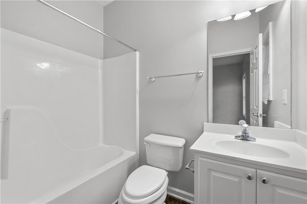 3072 Lauren Parc Road Decatur, GA 30032 - Photo 10 of 36 a bathroom with a sink toilet and shower