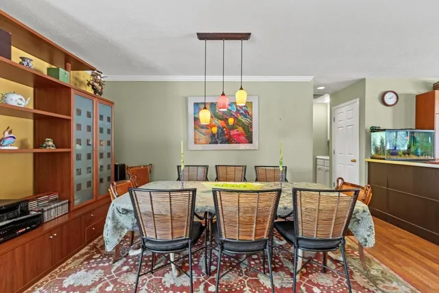 a kitchen with lots of counter space a sink appliances and a dining table