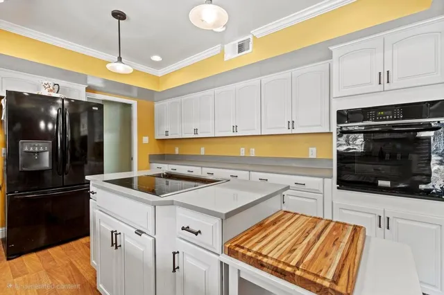 a kitchen with a large window and a sink