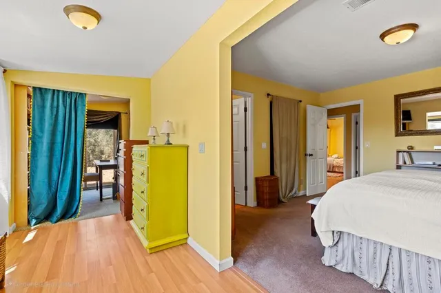 a bedroom with a bed and a couch