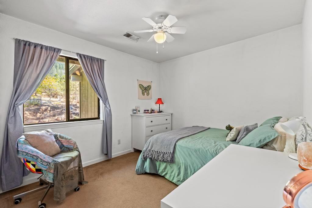 13467 Lake Francis Road Dobbins, CA 95935 - Photo 31 of 54 a bedroom with two beds and a window