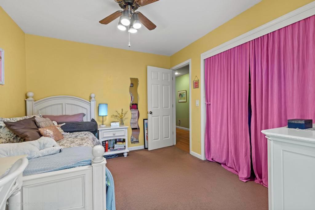 13467 Lake Francis Road Dobbins, CA 95935 - Photo 34 of 54 a bedroom with a bed and a chandelier