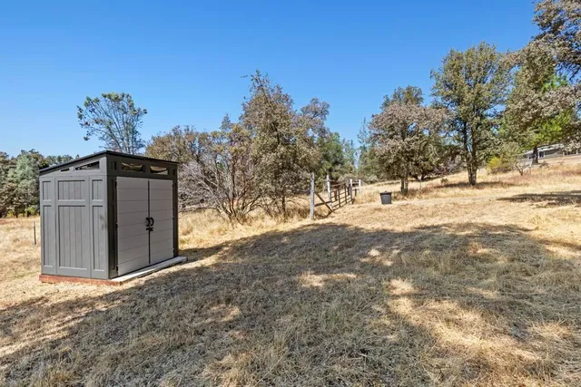 a view of a backyard of a house