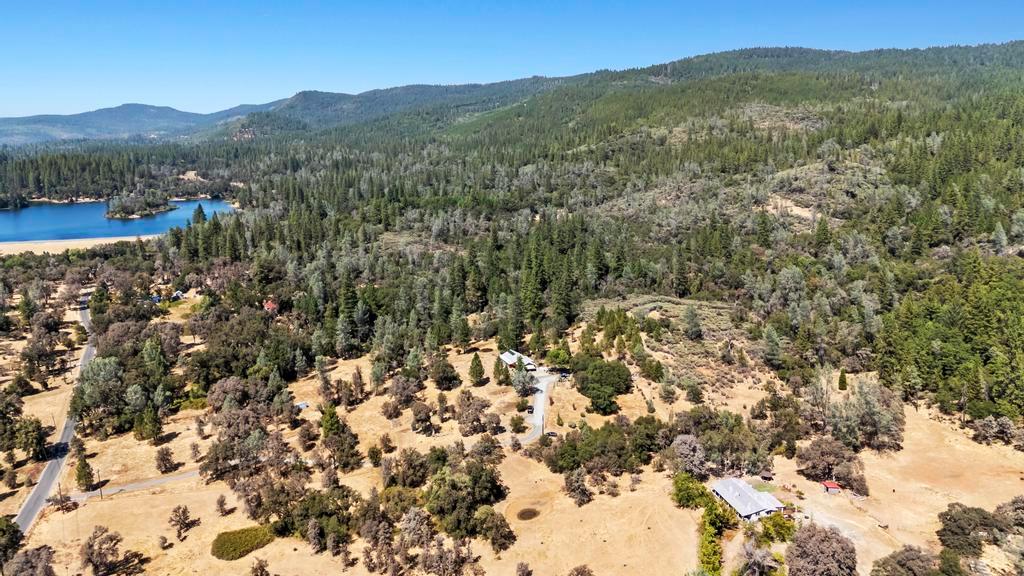 13467 Lake Francis Road Dobbins, CA 95935 - Photo 47 of 54 drone / aerial view of a water and mountain view and a heavily wooded area