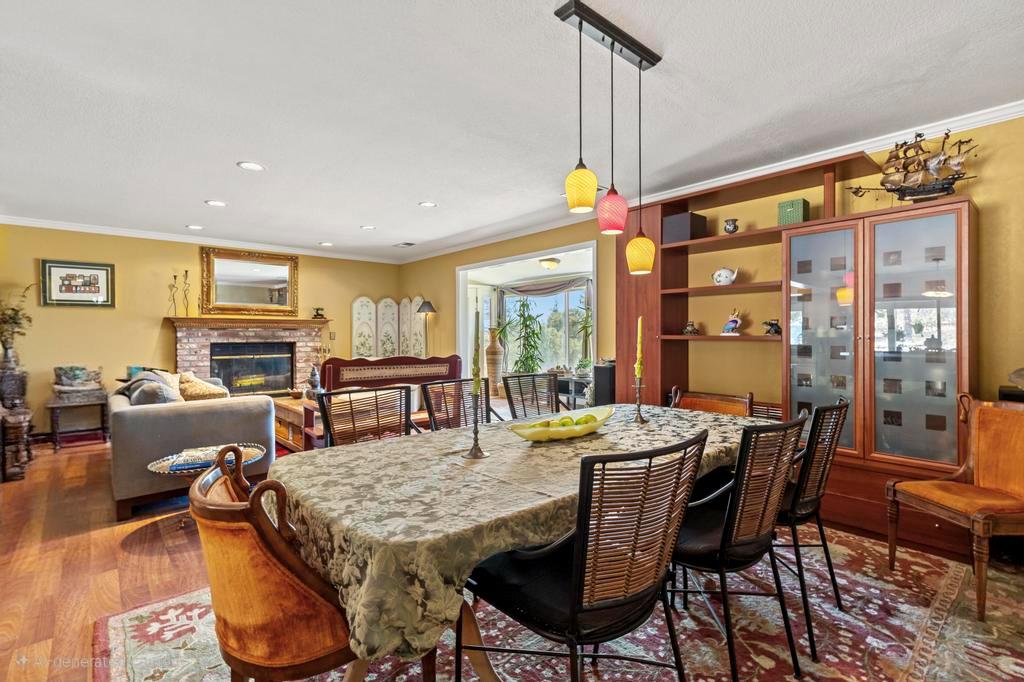 13467 Lake Francis Road Dobbins, CA 95935 - Photo 9 of 54 a dining room with furniture a chandelier and wooden floor