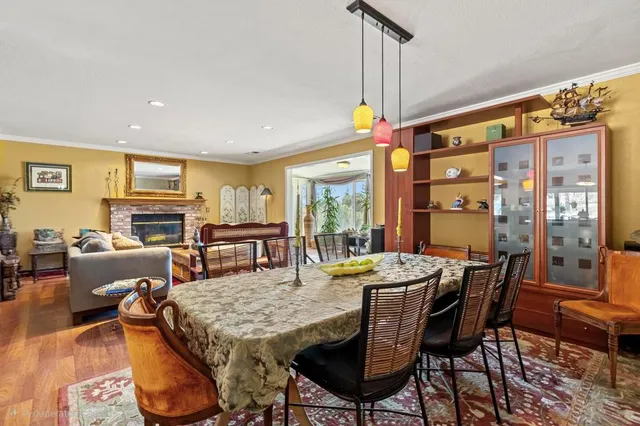 a dining room with furniture and window