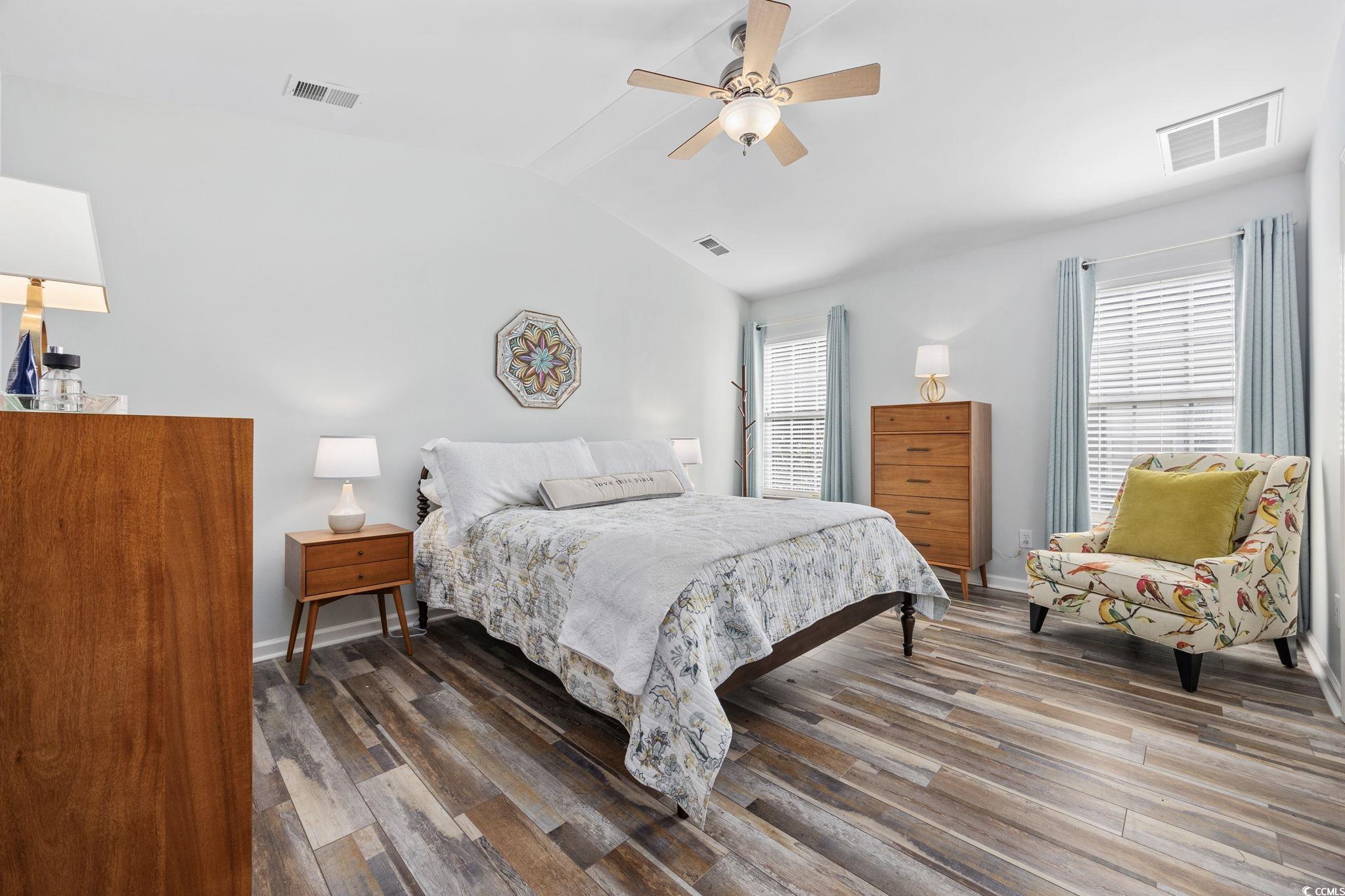 4618 Fringetree Drive Murrells Inlet, SC 29576 - Photo 12 of 40 Bedroom with dark wood-type flooring, vaulted ceiling, and a ceiling fan
