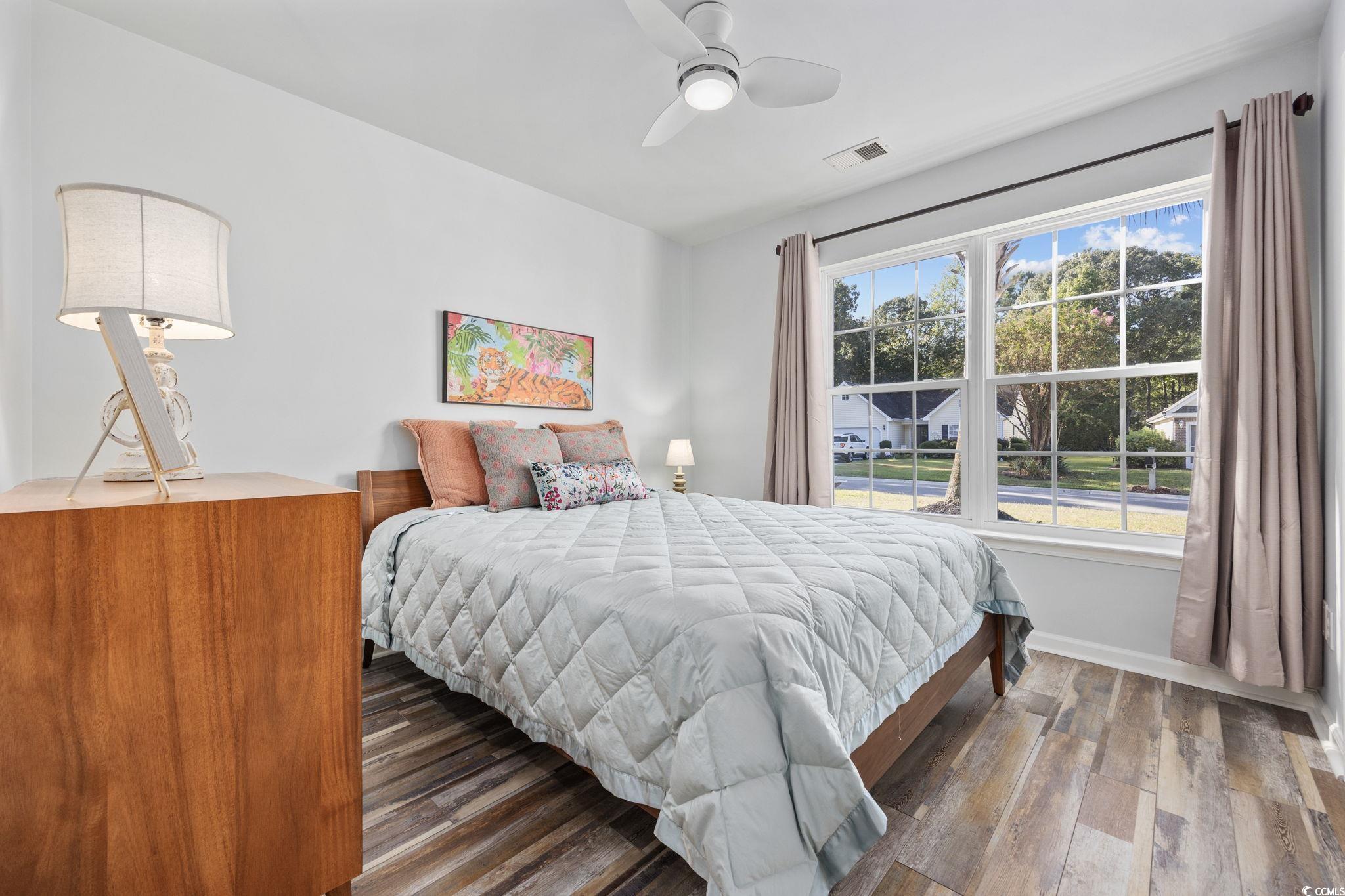 4618 Fringetree Drive Murrells Inlet, SC 29576 - Photo 17 of 40 Bedroom featuring wood finished floors and a ceiling fan