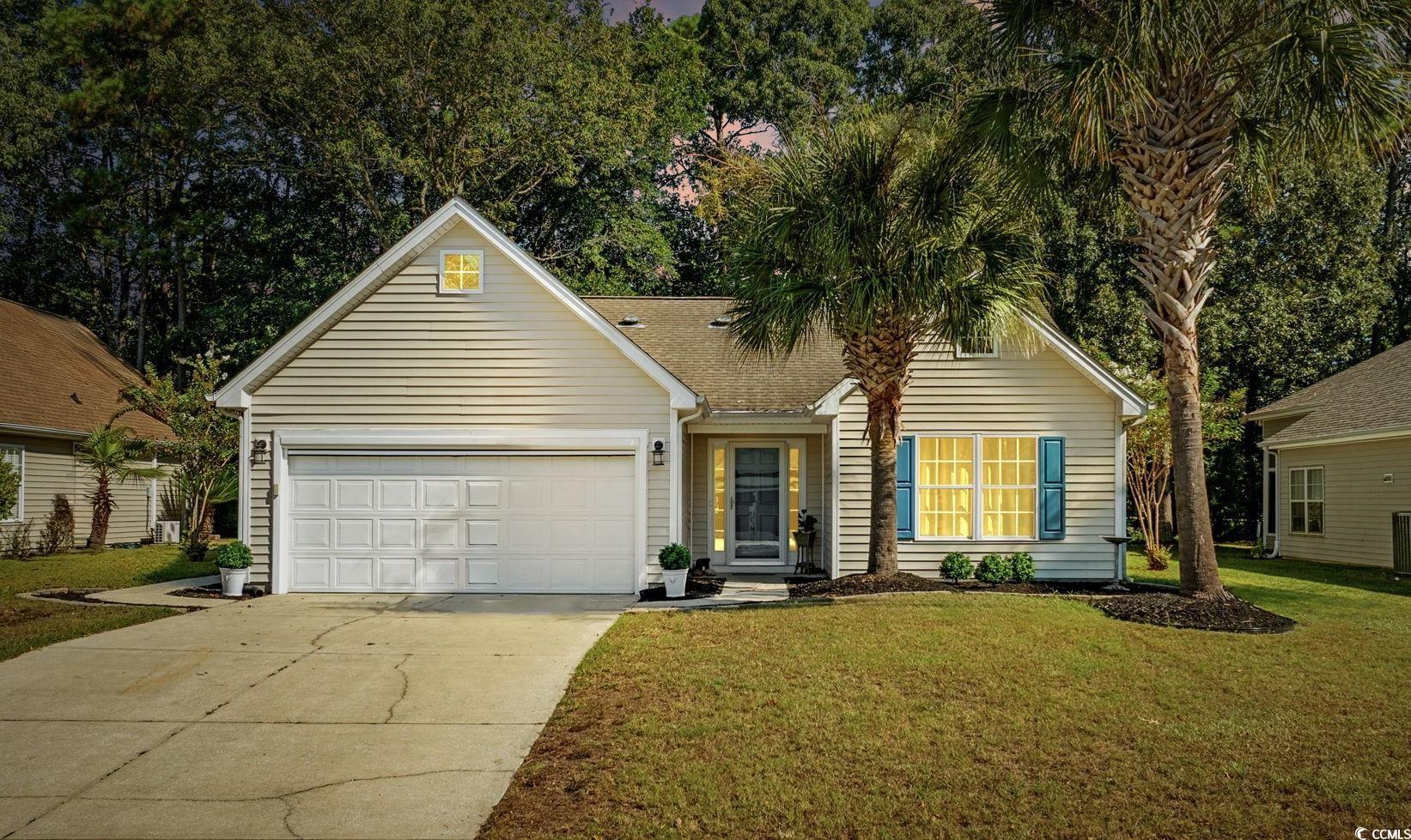 4618 Fringetree Drive Murrells Inlet, SC 29576 - Photo 2 of 40 Traditional home with driveway, a front lawn, and an attached garage