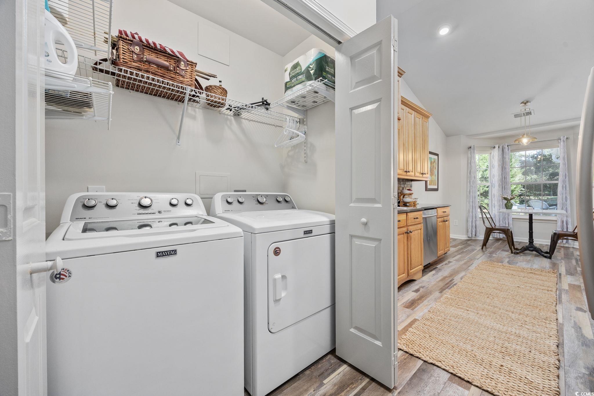 4618 Fringetree Drive Murrells Inlet, SC 29576 - Photo 26 of 40 Washroom with light wood-type flooring and washing machine and dryer