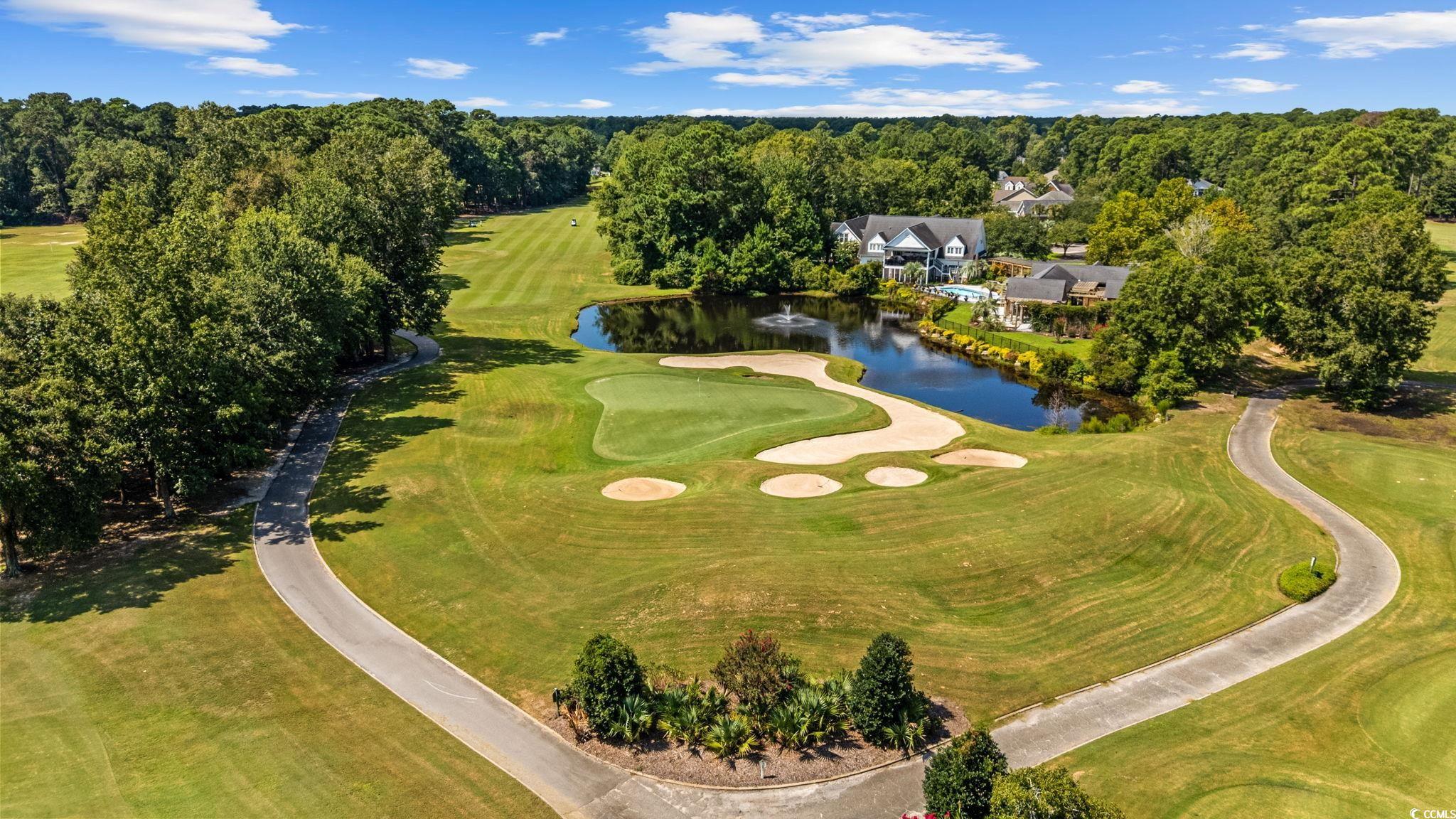 4618 Fringetree Drive Murrells Inlet, SC 29576 - Photo 33 of 40 Drone / aerial view of a golf course and a large body of water