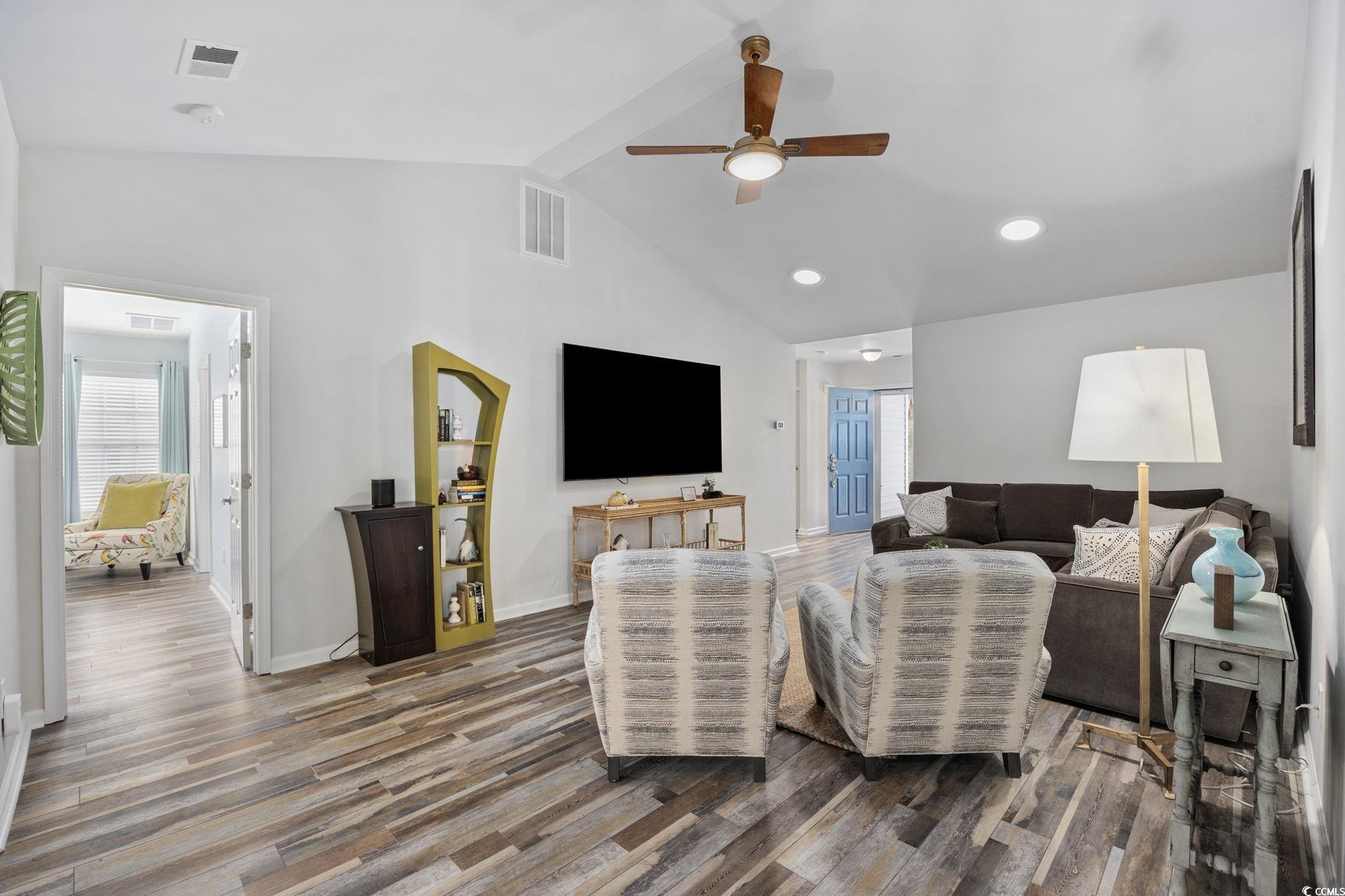 4618 Fringetree Drive Murrells Inlet, SC 29576 - Photo 5 of 40 Living area with wood finished floors, a ceiling fan, beamed ceiling, plenty of natural light, and high vaulted ceiling