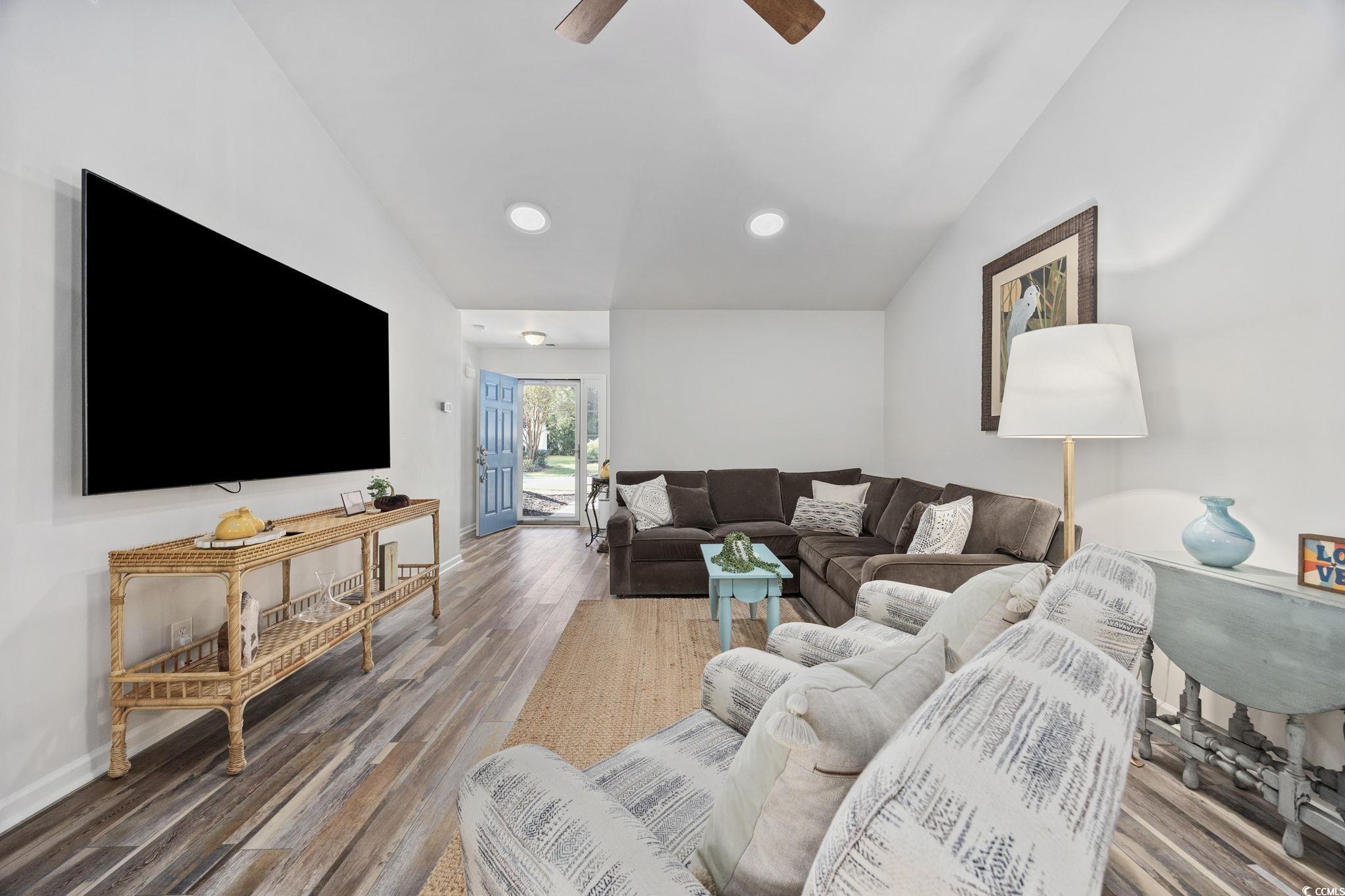 4618 Fringetree Drive Murrells Inlet, SC 29576 - Photo 6 of 40 Living area featuring lofted ceiling, wood finished floors, ceiling fan, and recessed lighting