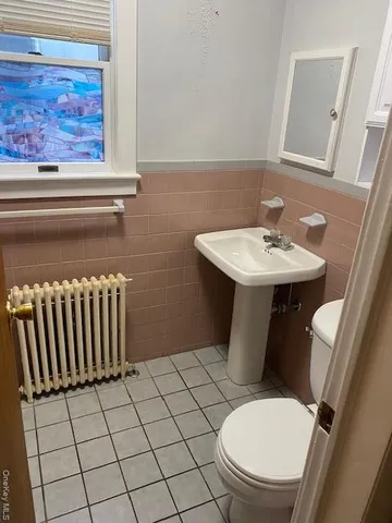 a view of a parking space with cars parked