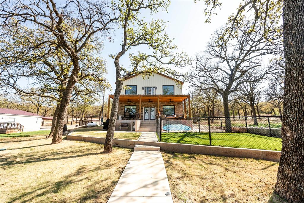 1529 Casino Road Nocona, TX 76255 - Photo 13 of 35 a view of a large trees with a big yard and large tree