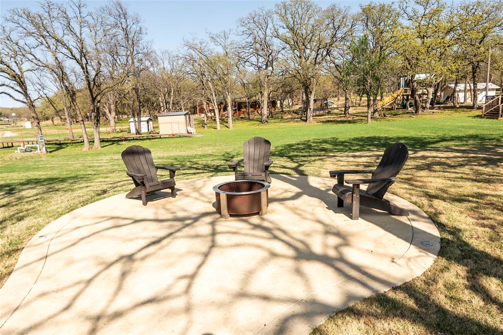 1529 Casino Road Nocona, TX 76255 - Photo 15 of 35 a view of a swimming pool and lounge chairs