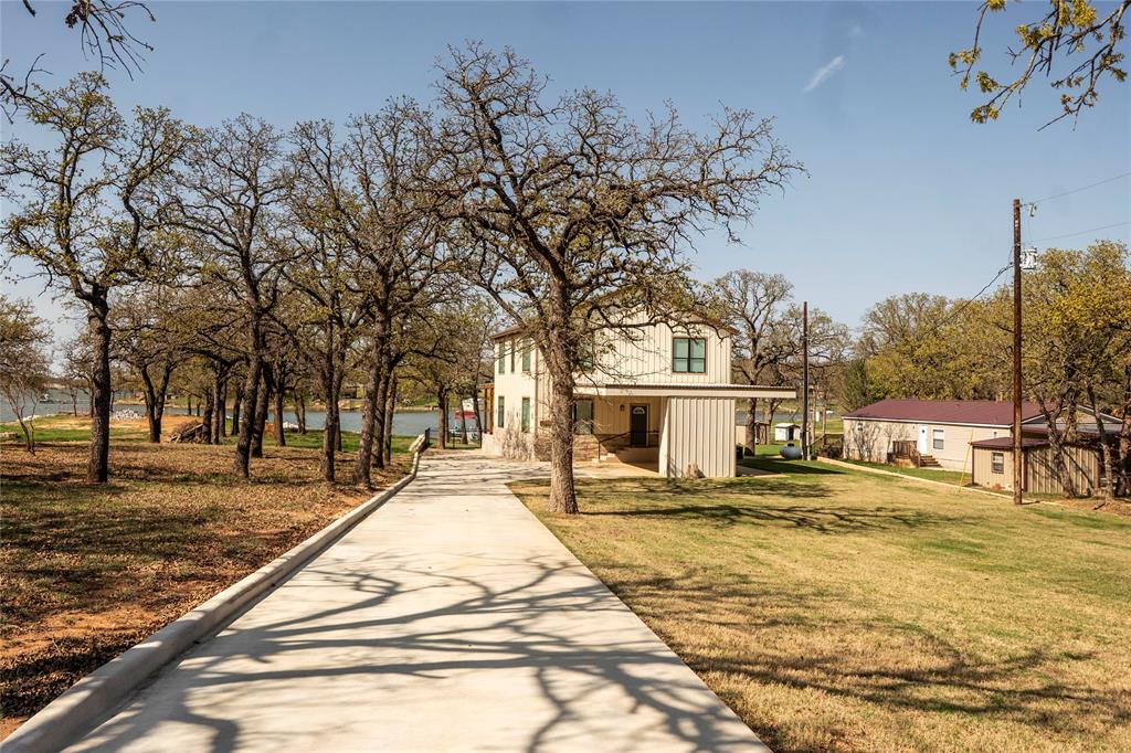 1529 Casino Road Nocona, TX 76255 - Photo 2 of 35 a view of swimming pool with trees