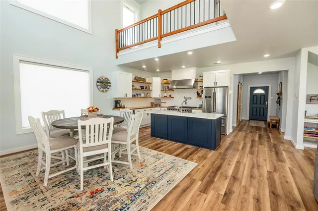 a view of entryway livingroom and hall with wooden floor