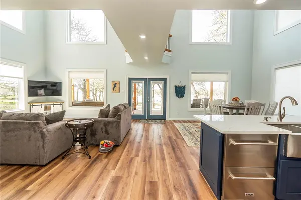 a living room with furniture window and wooden floor