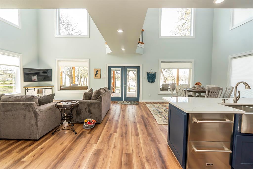 1529 Casino Road Nocona, TX 76255 - Photo 28 of 35 a living room with stainless steel appliances granite countertop furniture wooden floor and a large window