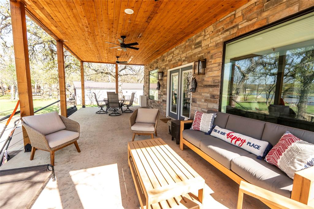 1529 Casino Road Nocona, TX 76255 - Photo 10 of 35 a living room with furniture and a floor to ceiling window