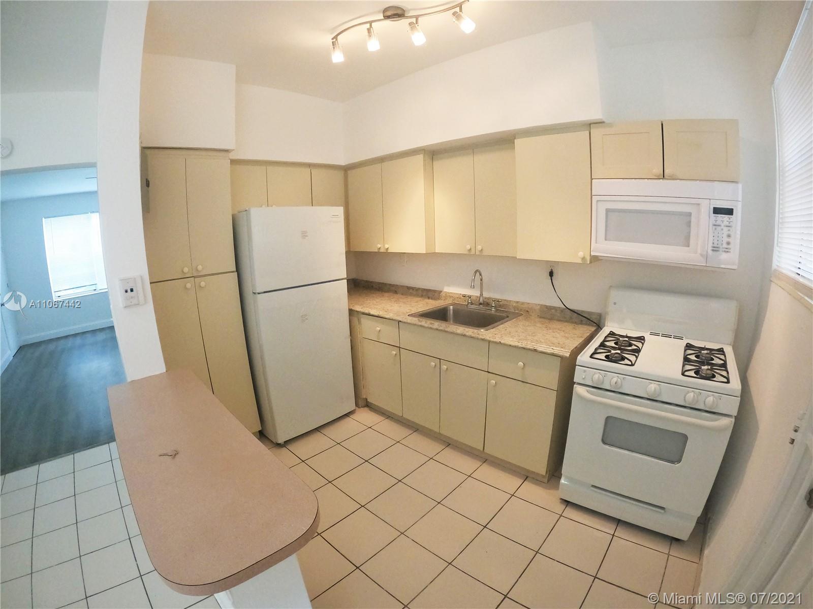 809 85th Street Miami Beach, FL 33141 - Photo 14 of 32 a utility room with sink dryer and washer