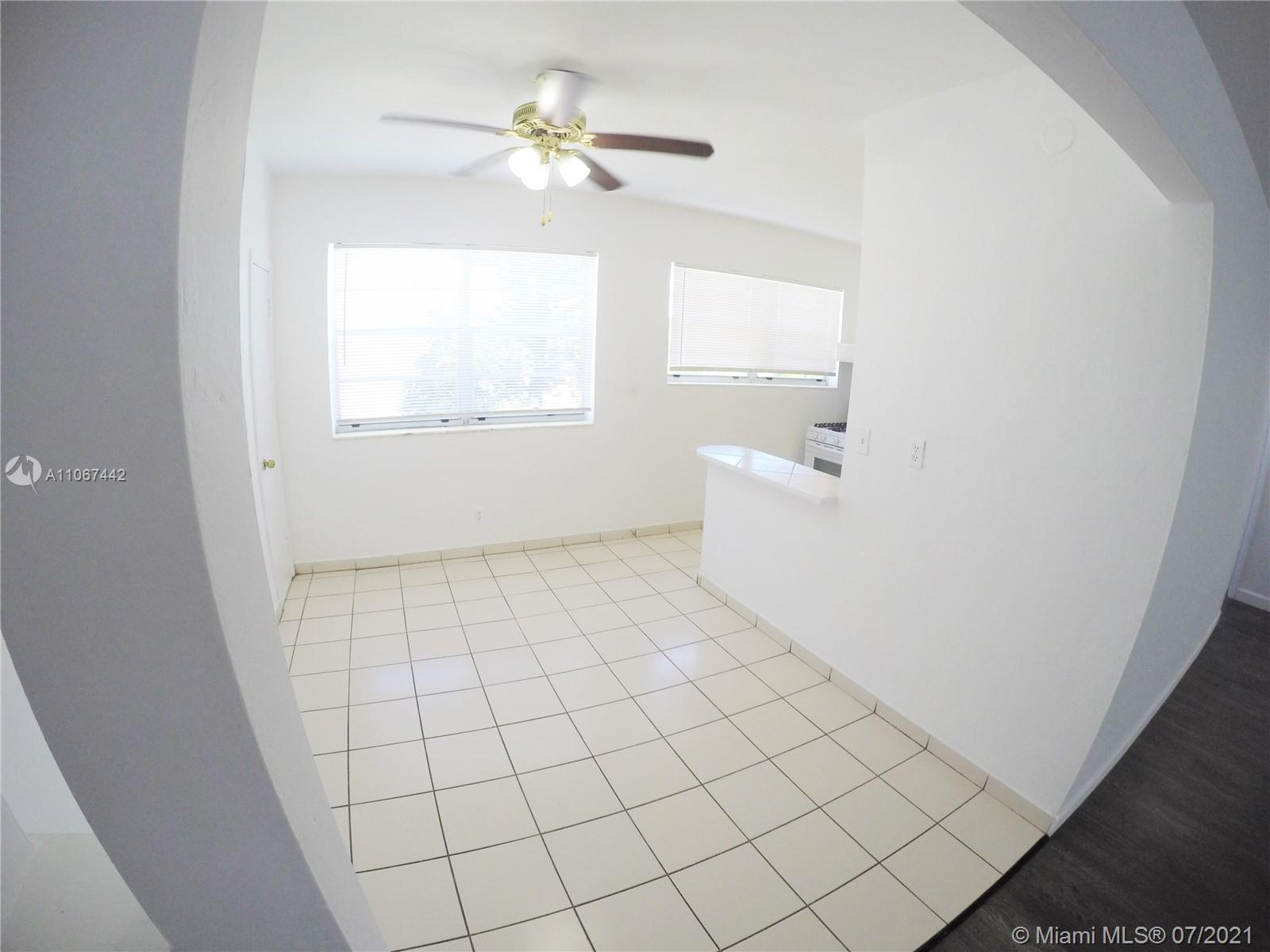 809 85th Street Miami Beach, FL 33141 - Photo 5 of 32 a view of an empty room with a window
