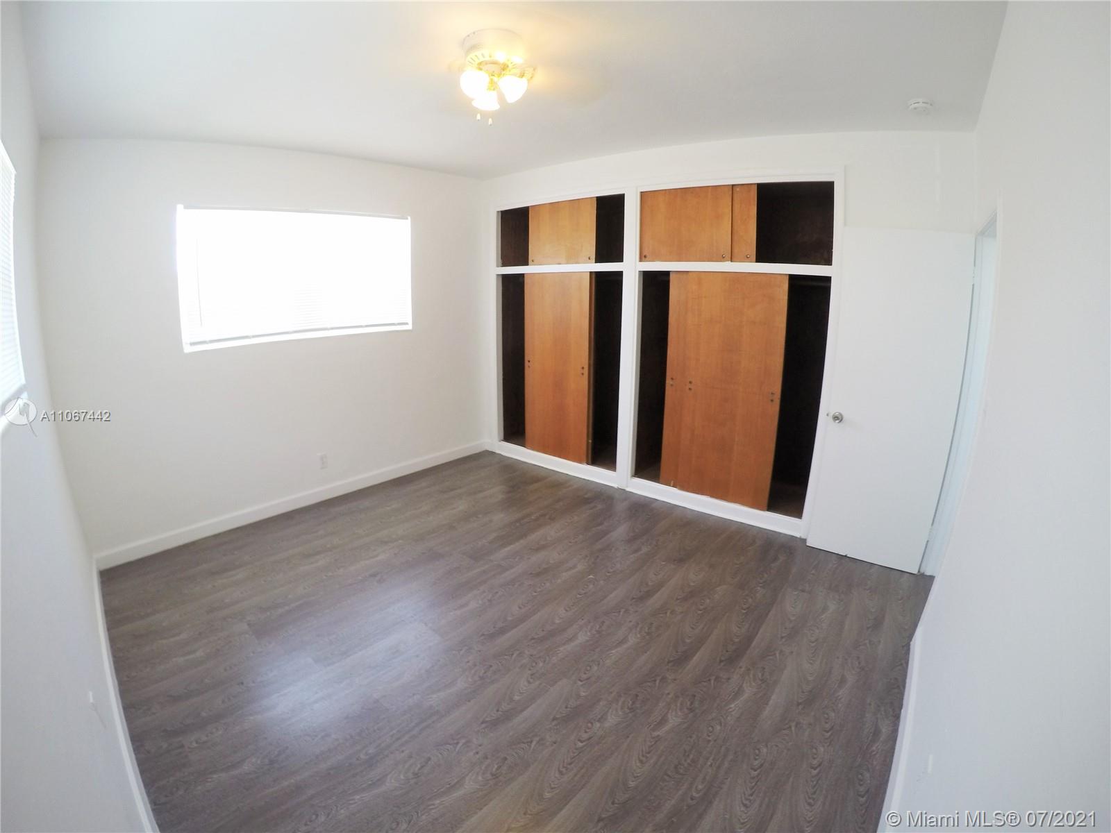 809 85th Street Miami Beach, FL 33141 - Photo 10 of 32 a view of a room with wooden floor