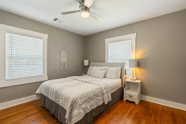 a bedroom with a bed and a chair