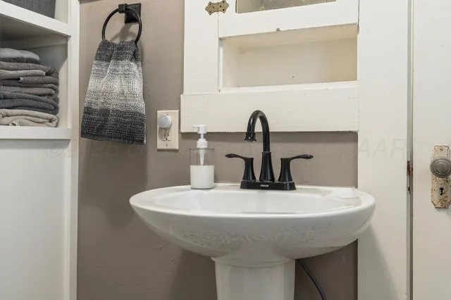 a bedroom with a bed and furniture