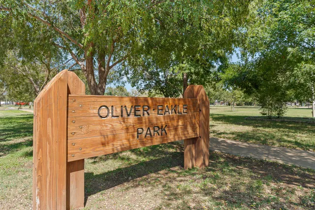 a view of a grassy field with trees