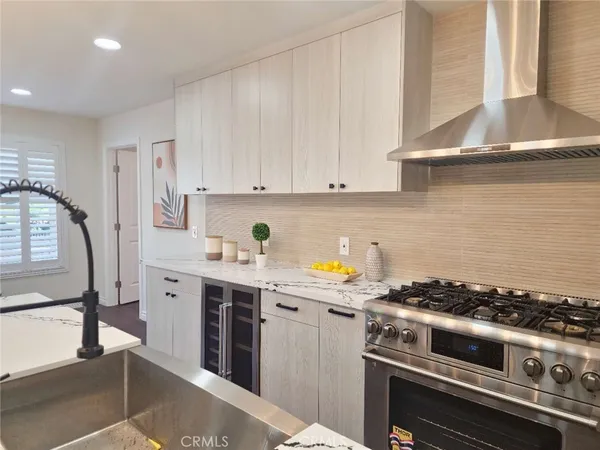 a kitchen with stainless steel appliances granite countertop a stove and a sink