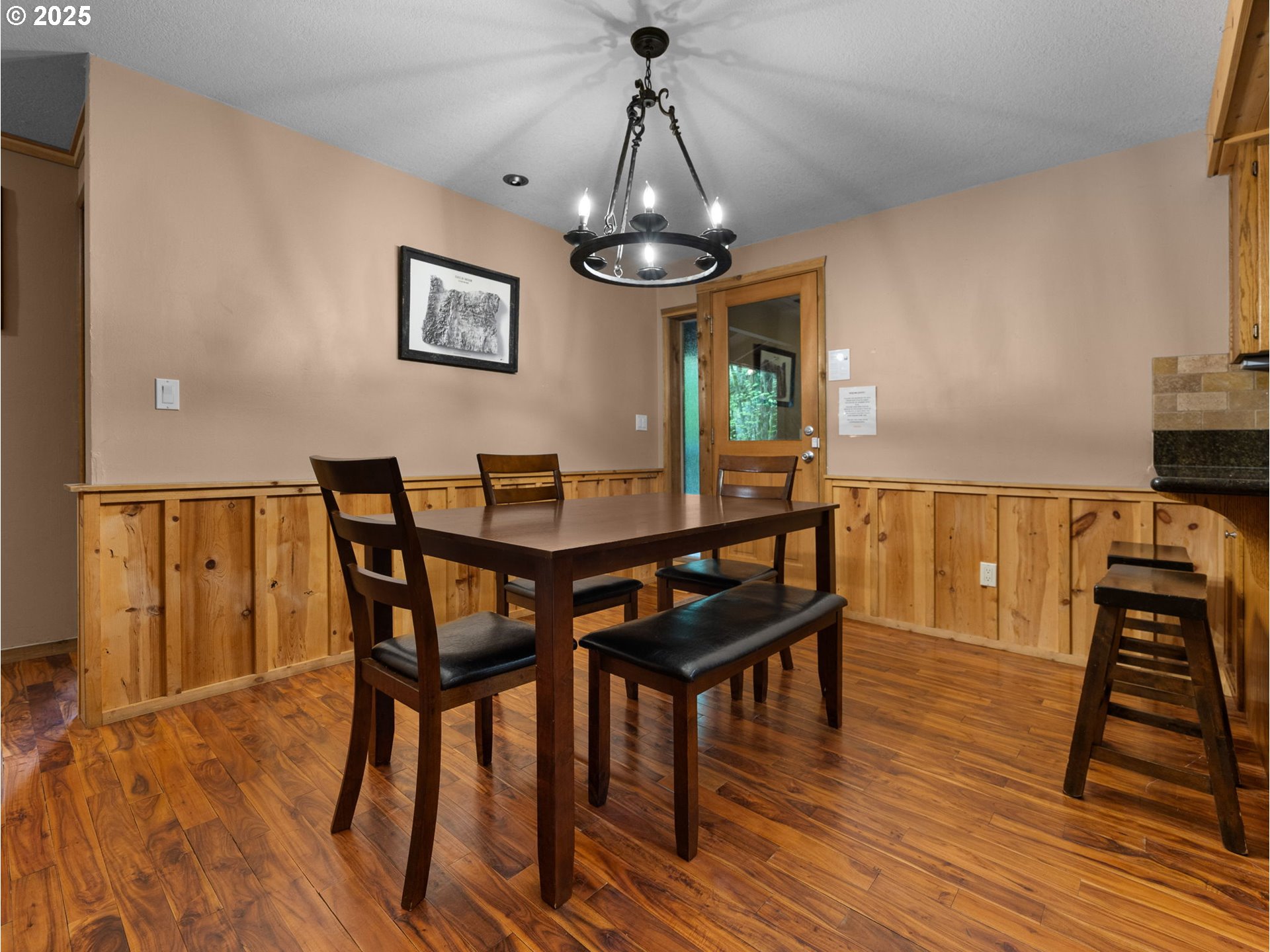 72683 East Village Loop Road Rhododendron, OR 97049 - Photo 8 of 40 a dining room with furniture a chandelier and wooden floor