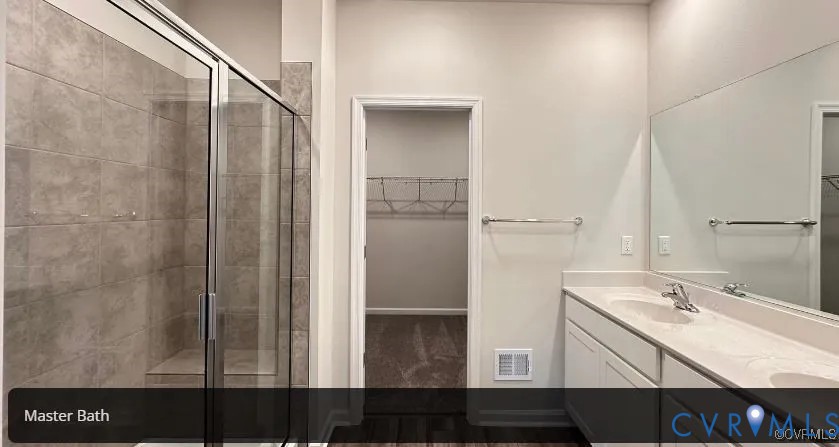 6455 Fennec Run Moseley, VA 23120 - Photo 12 of 18 Bathroom featuring a spacious closet, a shower sta