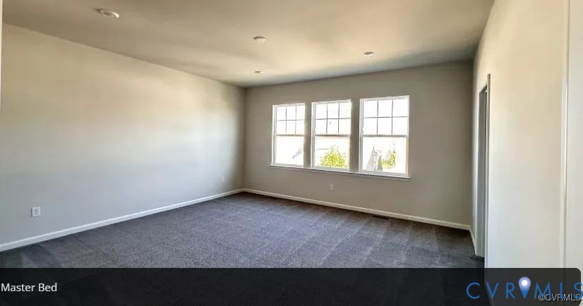 6455 Fennec Run Moseley, VA 23120 - Photo 13 of 18 Empty room with dark carpet and baseboards