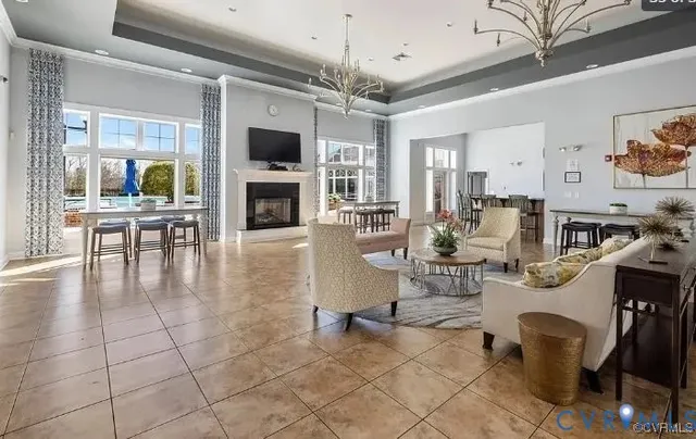 a living room with fireplace furniture and a flat screen tv