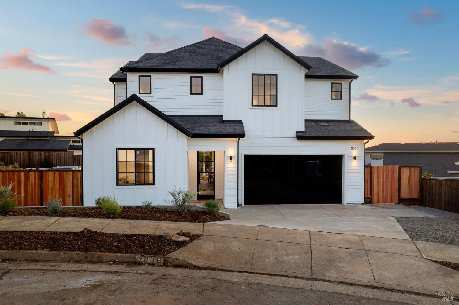a front view of a house with a garage