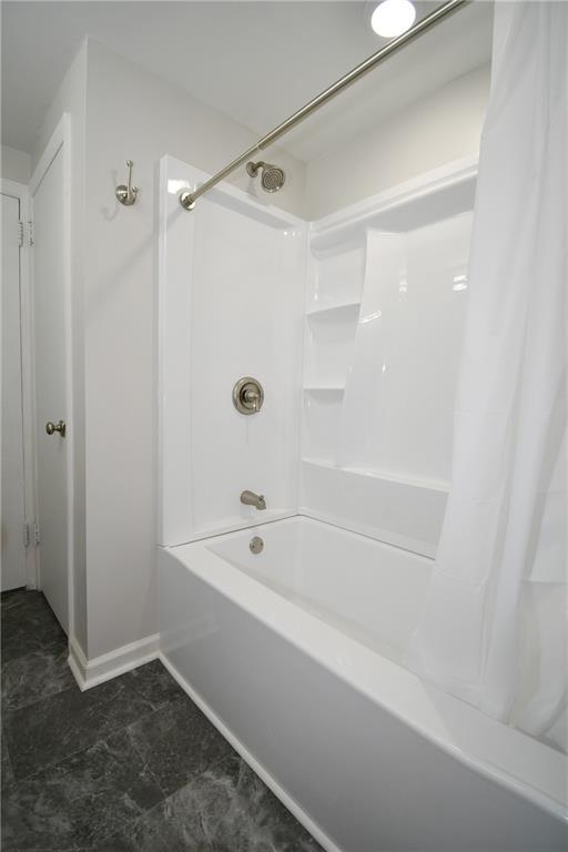 217 Oaklyn Road Bethel Park, PA 15102 - Photo 16 of 42 a bathroom with a bathtub and a shower