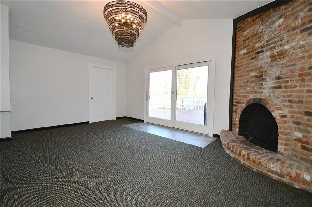 217 Oaklyn Road Bethel Park, PA 15102 - Photo 18 of 42 an empty room with a fireplace