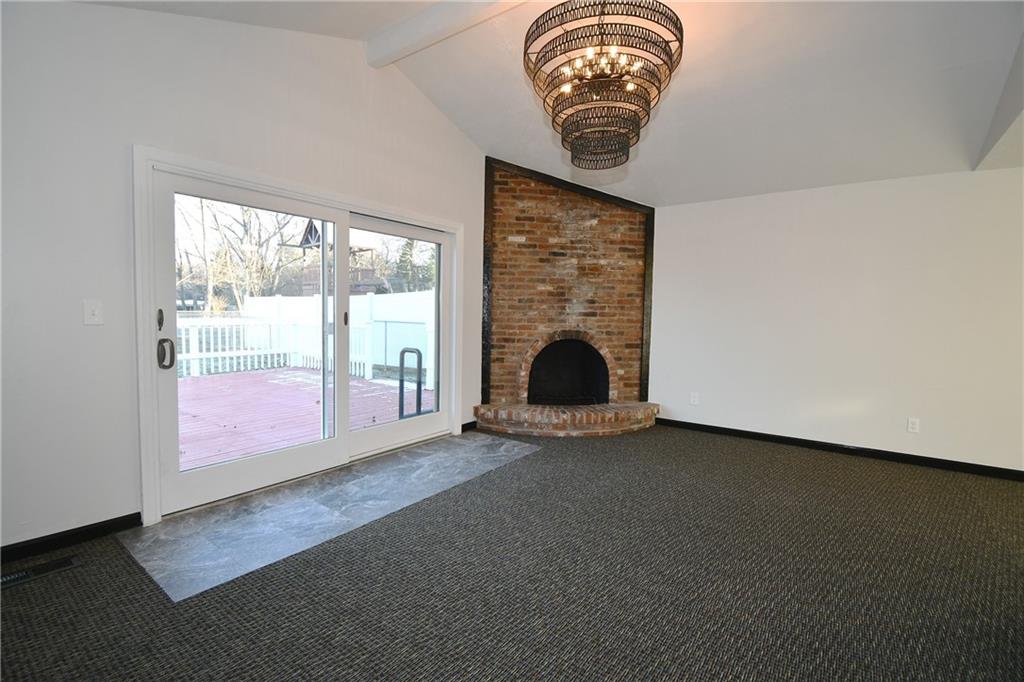 217 Oaklyn Road Bethel Park, PA 15102 - Photo 20 of 42 an empty room with a fireplace