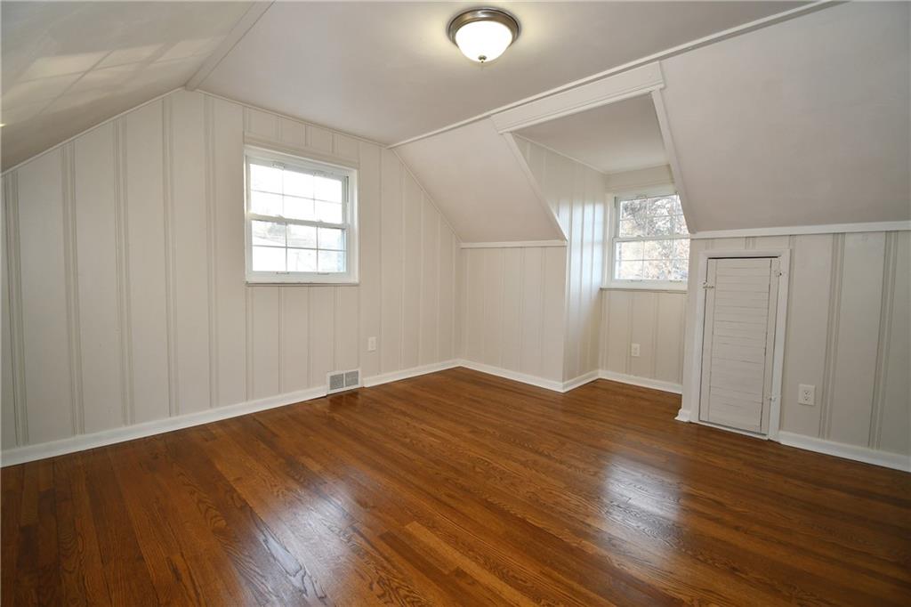 217 Oaklyn Road Bethel Park, PA 15102 - Photo 29 of 42 an empty room with wooden floor and windows