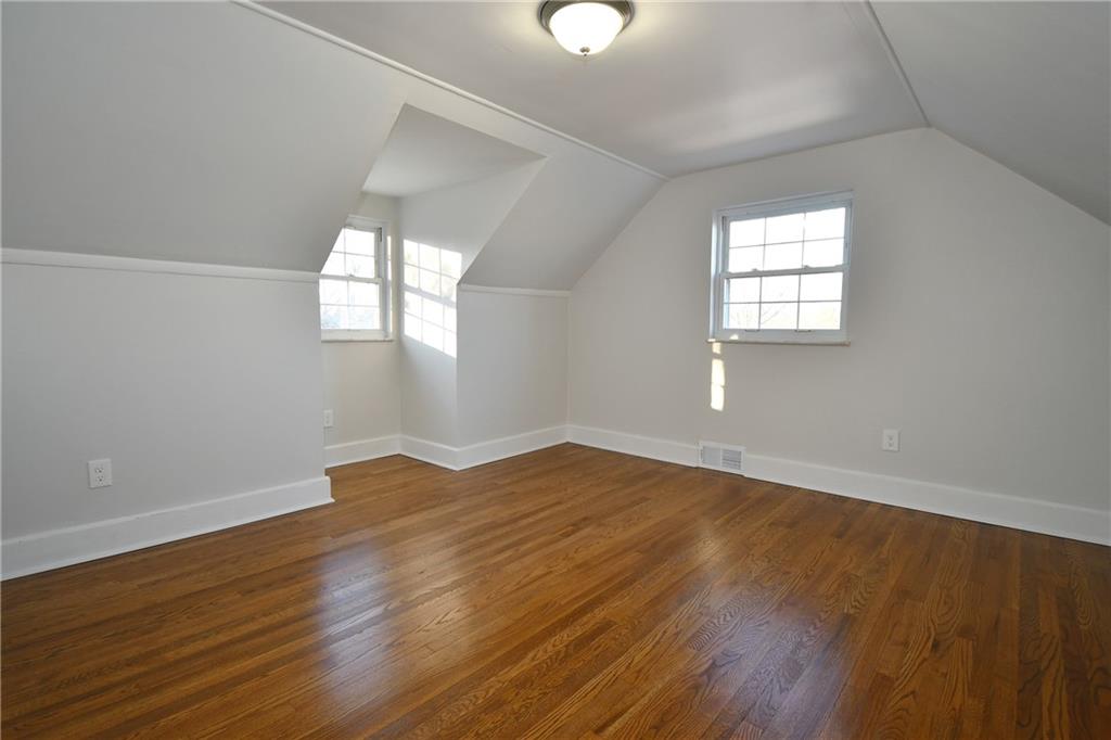 217 Oaklyn Road Bethel Park, PA 15102 - Photo 31 of 42 an empty room with wooden floor and windows